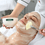 A therapist applies a treatment to a client having a facial